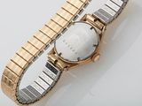 a watch that is laying on a table