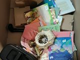 a box full of books and a cell phone in it