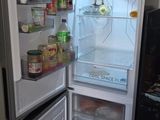 a refrigerator with its door open in a kitchen