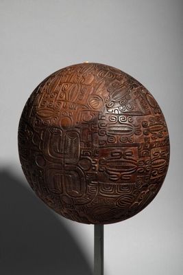 an image of a wooden ball with a design on it
