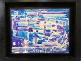 painting of a cityscape in a black frame on a white wall