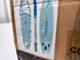 packaging of a blue and white surfboard sitting on top of a cardboard box