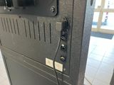 a tv mounted on the side of a wall in a room