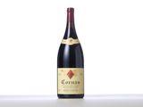 a bottle of red wine sitting on top of a table