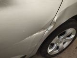 a close up of a car that has a dent in it