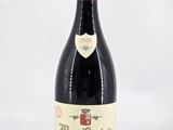 a bottle of wine that is sitting on a table