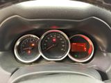 three gauges on the dashboard of a car
