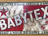 une enseigne portant l'inscription « babytex » sur le côté d'un immeuble