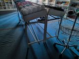 a cart that has balls in it in a store
