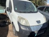 a white van that is parked next to other cars