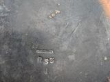a metal pan with a lid that has a hole in it