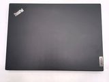 a black laptop that is sitting on a white surface