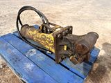 a blue wooden bench with a rusted metal object on it