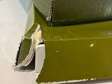 two green books stacked on top of each other on a table