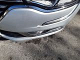 a close up of a car ' s headlight and front bumper