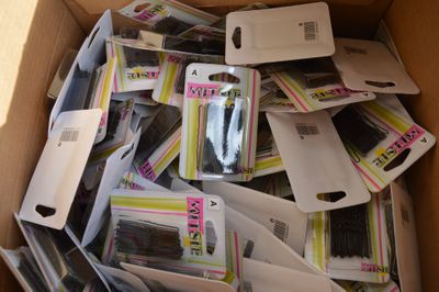 a cardboard box filled with assorted items for sale