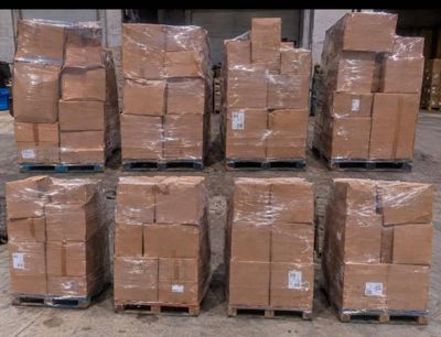 a lot of boxes stacked on pallets in a warehouse