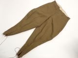 an image of a pair of khaki pants laying on a white surface