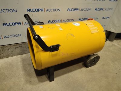a large yellow barrel sitting on top of a metal cart