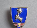 a close up of a badge with a hand holding a star