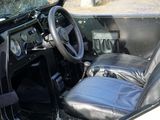 a black leather seat in the back of a car
