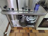 a picture of a kitchen with a lot of pots and pans