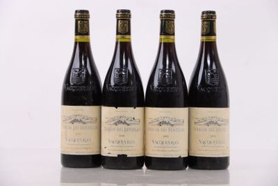 three bottles of wine are lined up on a table