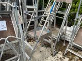 many chairs that are sitting in the dirt