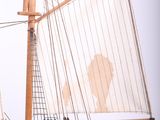 a small model of a sailboat on a stand
