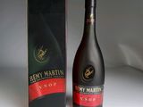 a bottle of wine that is next to a box