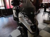 a motor scooter that is parked in a restaurant