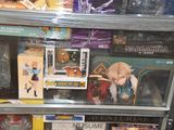 a display case full of action figures in a store