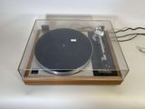 a turntable with a record player in it on a table