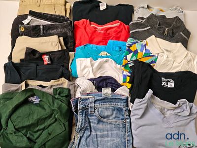 a pile of clothes that is sitting on a table