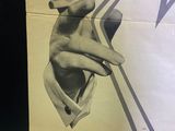 a black and white photo of a poster on a wall