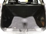 a trunk of a car with the back seats folded down
