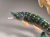 figurine of a fish with its mouth open and mouth wide open