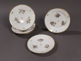 two plates and a bowl are sitting on a table