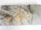 an image of a piece of rock that has been placed on a white surface