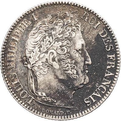 a close up of a coin with a man ' s face on it