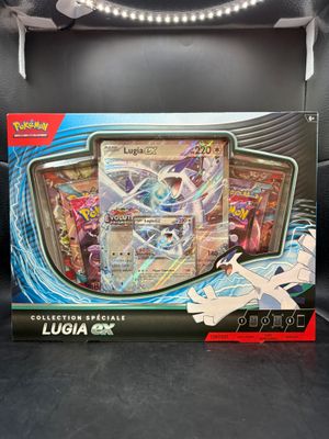 the box of the pokemon card game is open and ready to be played