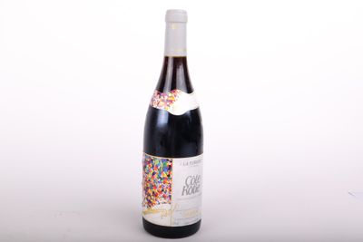 a bottle of wine with sprinkles on it