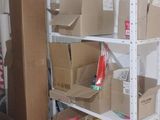 many boxes and boxes on the shelves in the room