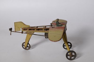 un petit avion miniature posé sur une surface blanche