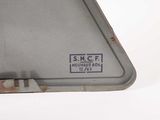 a piece of metal that has a sticker on it