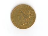an old gold coin with a woman ' s head on it