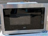 a microwave that is sitting on top of a box