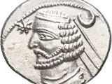 a close up of a coin with a man ' s face on it