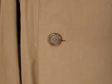 the back of a trench coat with buttons on a mannequin mannequin mannequin mannequin mannequin mannequin mannequin mann