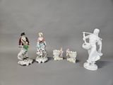 four figurines that are sitting on a table